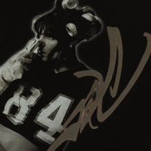 Cleo portrait and signature front print detail on black tee